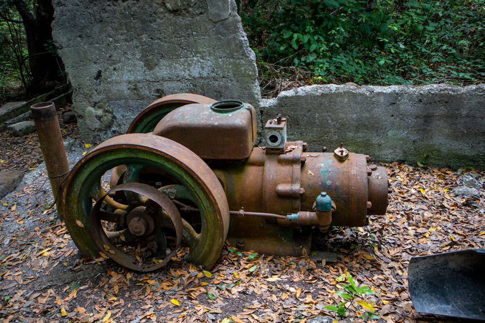 old equipment used for water extraction in front of the tunnel