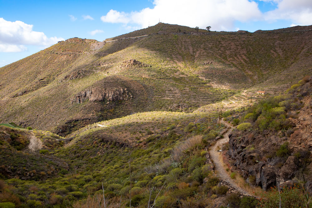 view to the hiking trail, mountains and abandoned house