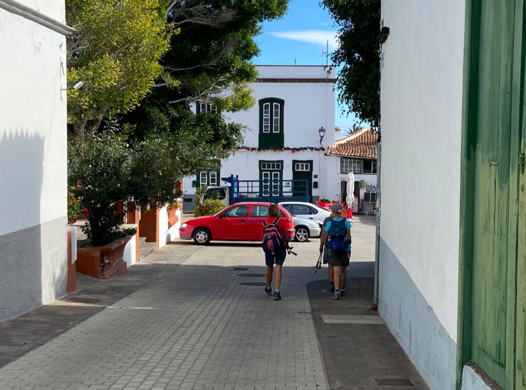 Hikers in front of the church square of Arico Nuevo