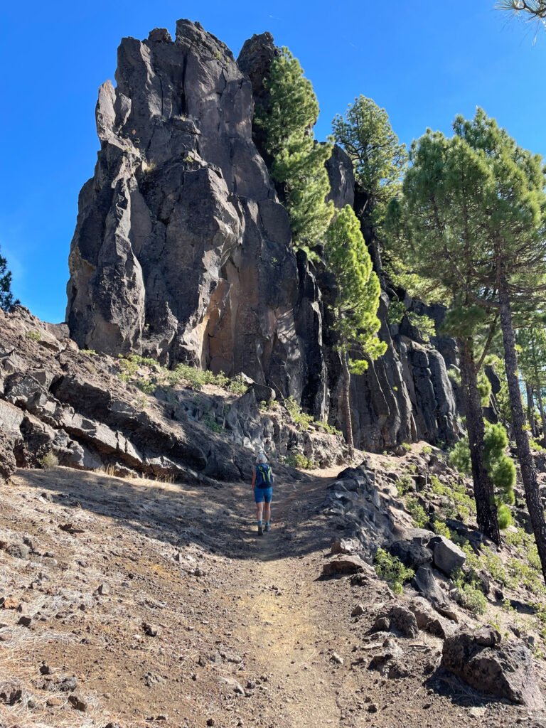 Hiking trail under Refugio Punta de Los Roques in front of the rock face