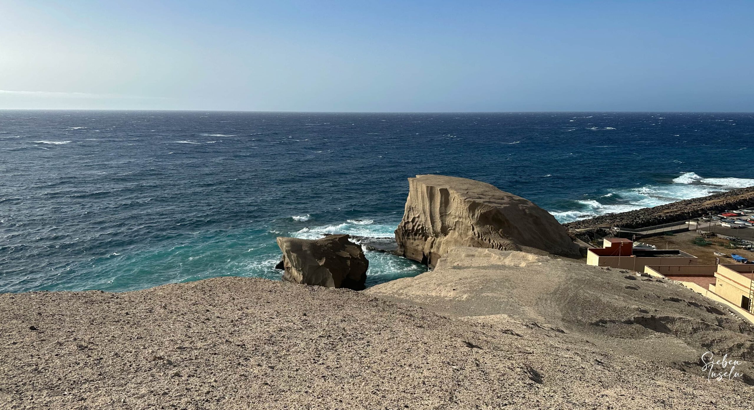 View from the hiking trail above the cliffs to the Atlantic Ocean and the beach in front of Tajao
